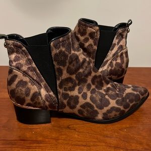 Nine West leopard print booties with a gold accent on the 1.5 in heel.